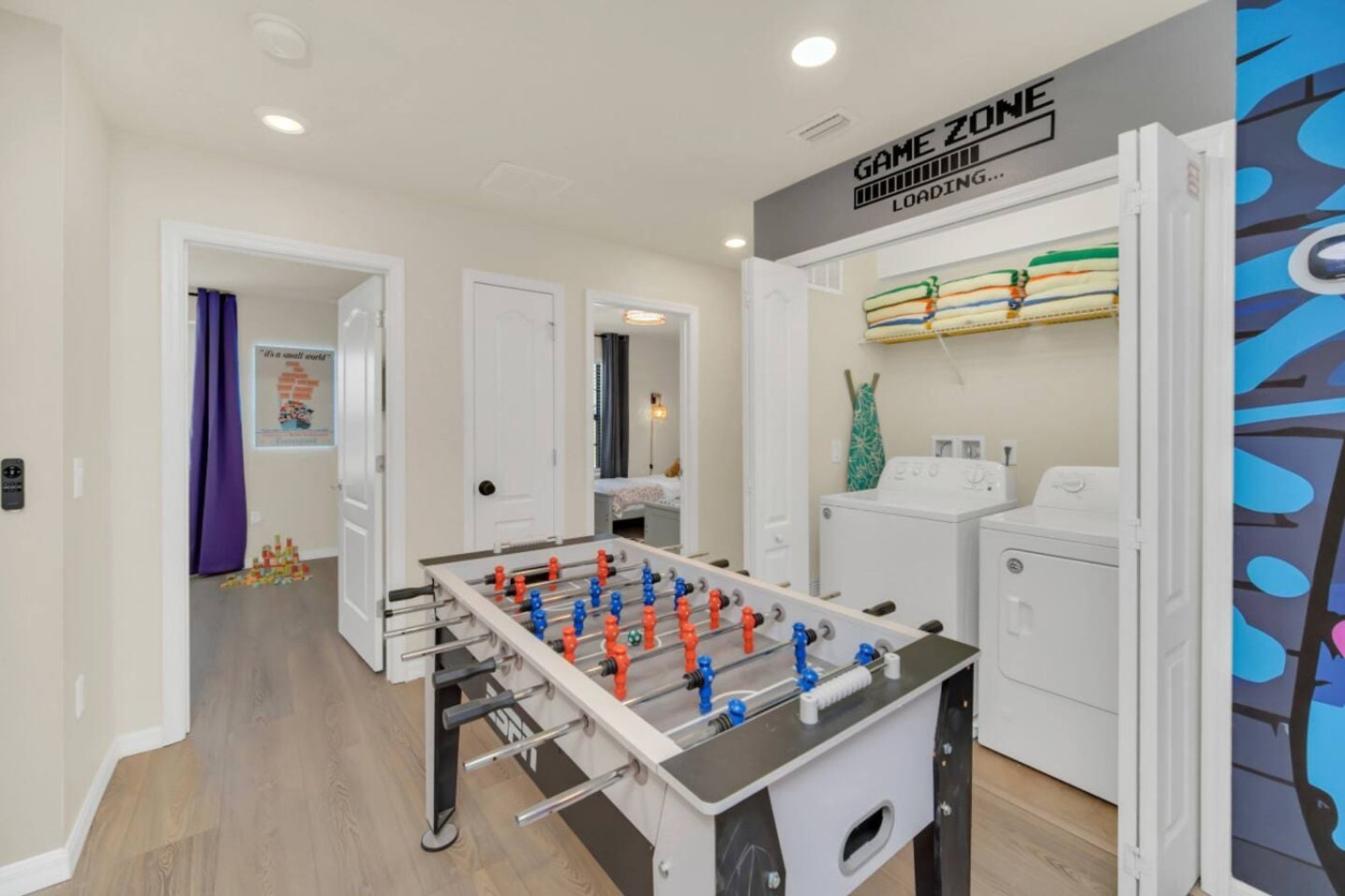 Game Zone sign over the foosball table and laundry alcove