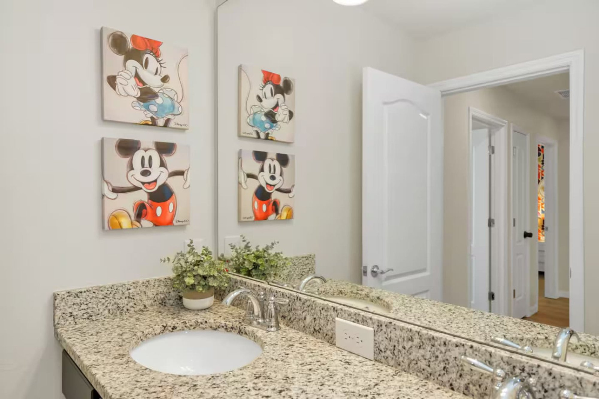Double-vanity bath with Mickey and Minnie prints