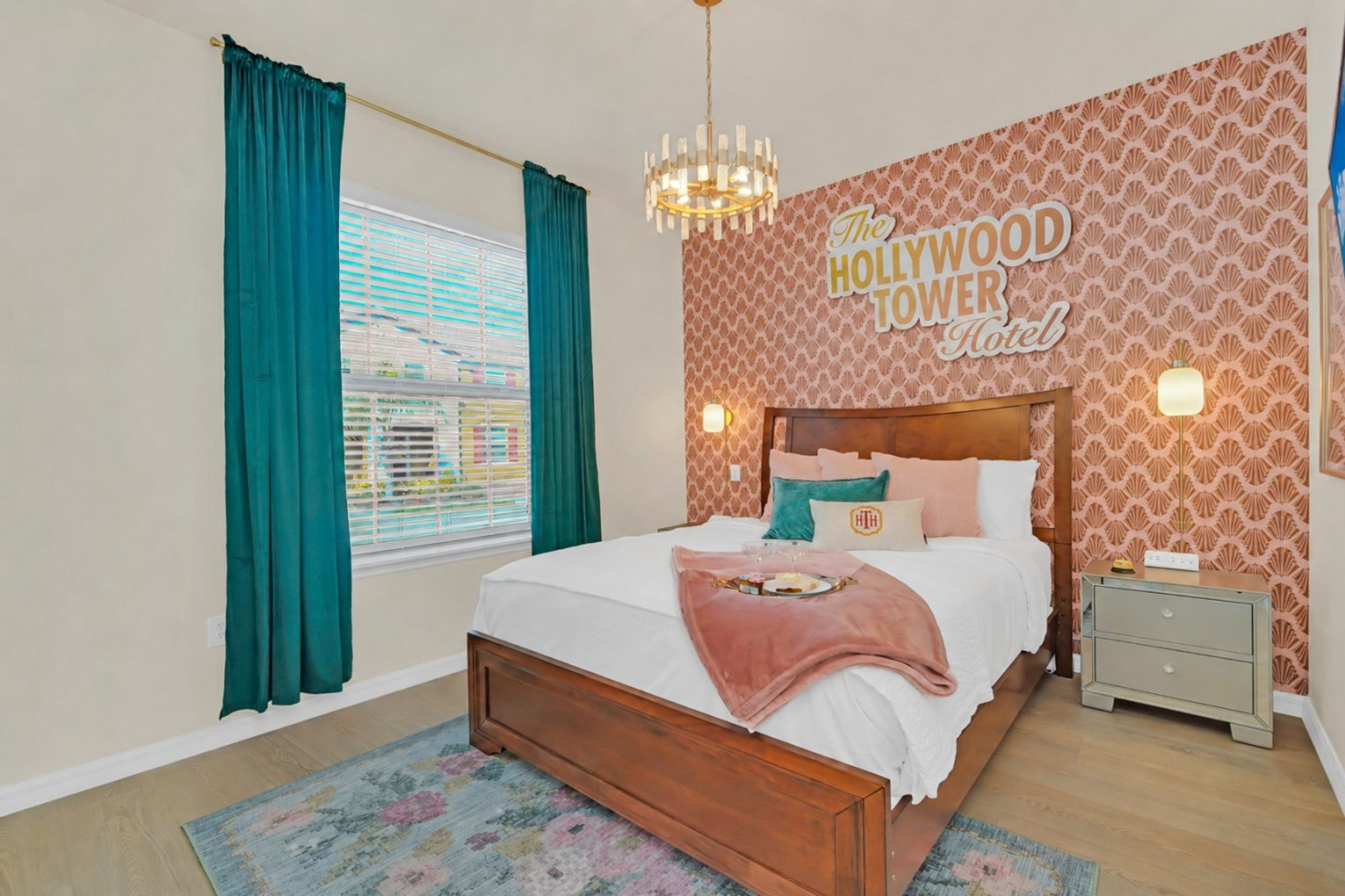 Bedroom 1 from the doorway, with the Hollywood Tower Hotel mural along the wall