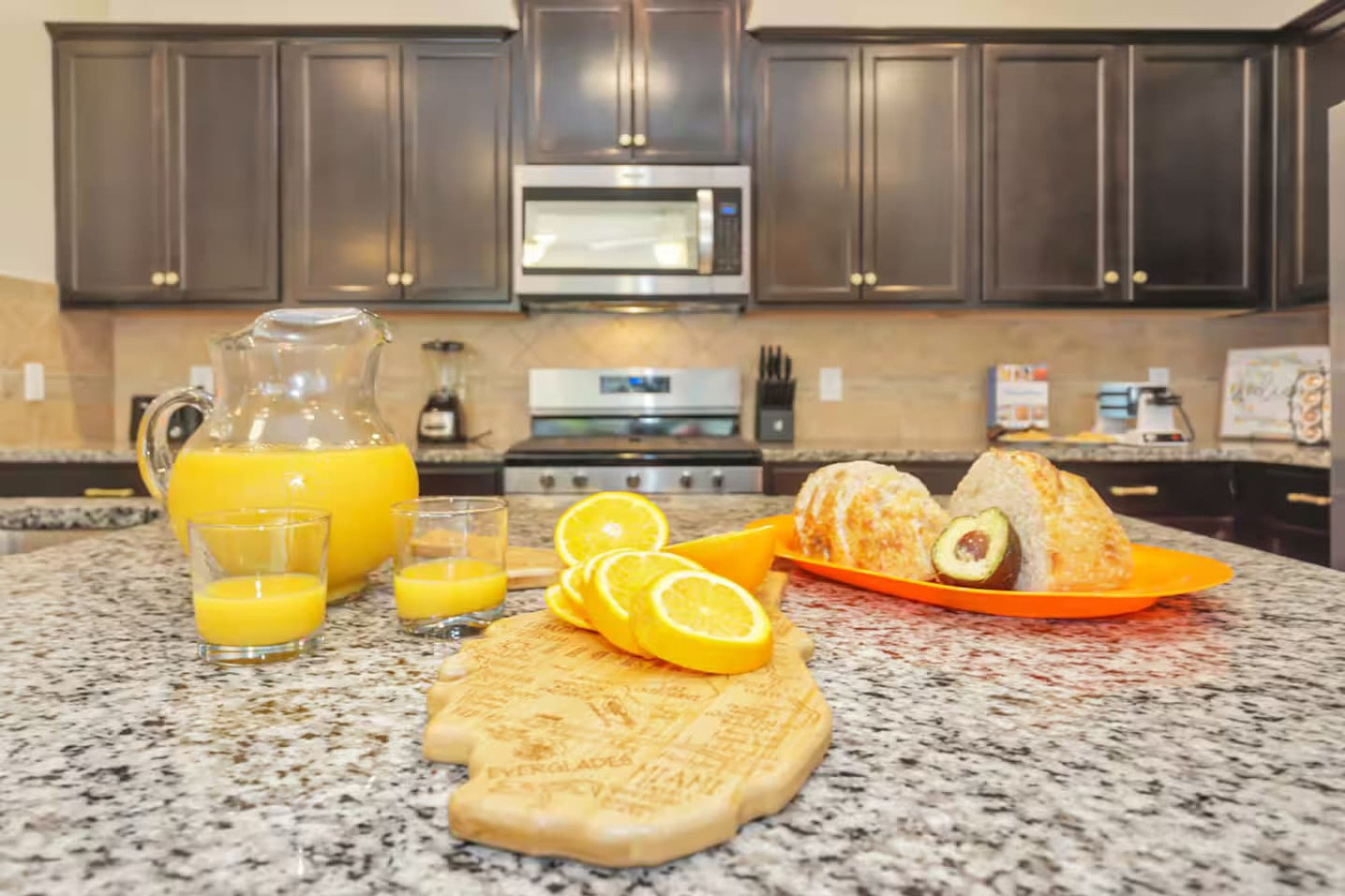 Fresh oranges and juice on the kitchen island