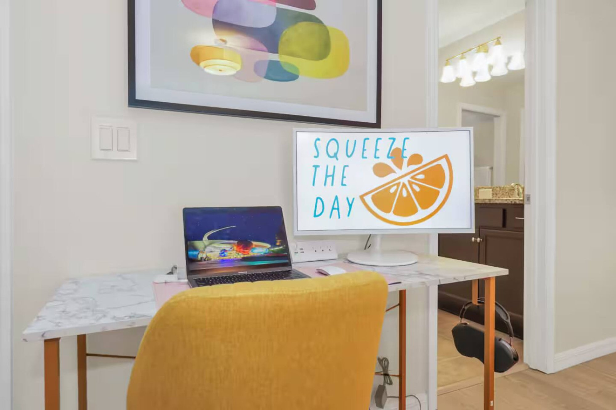 Dedicated workspace with a desk and the Squeeze the Day print
