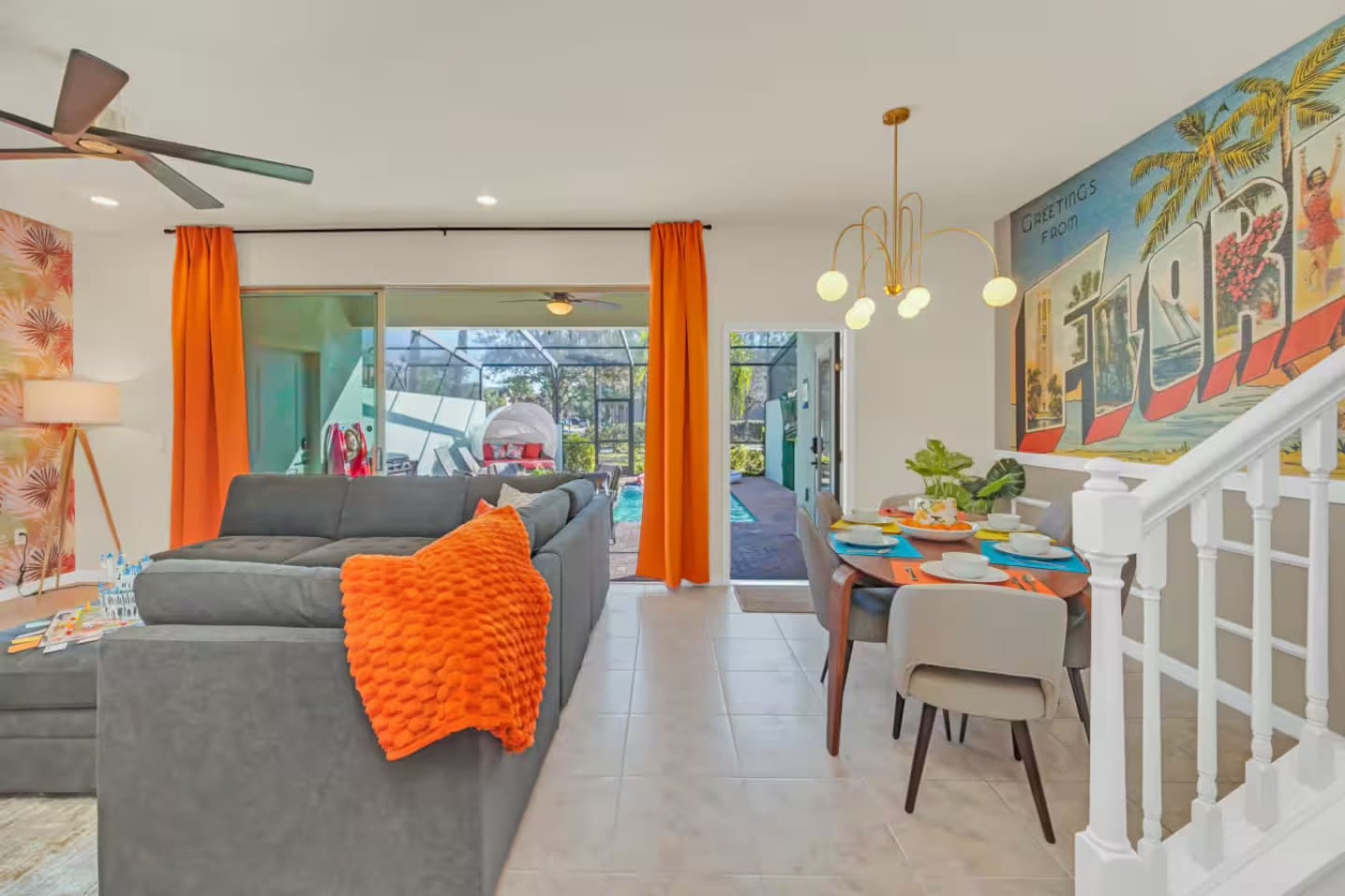 Living and dining areas with the staircase between them