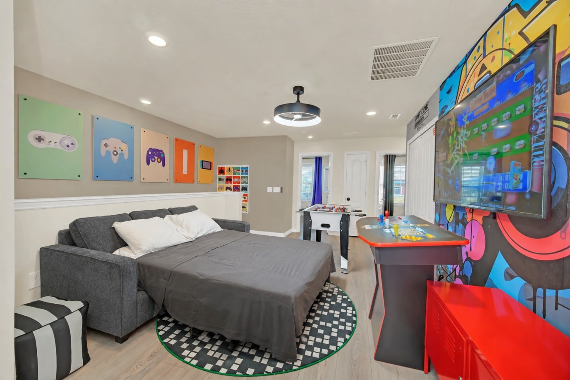 Game loft with the queen sleeper sofa made up as a bed