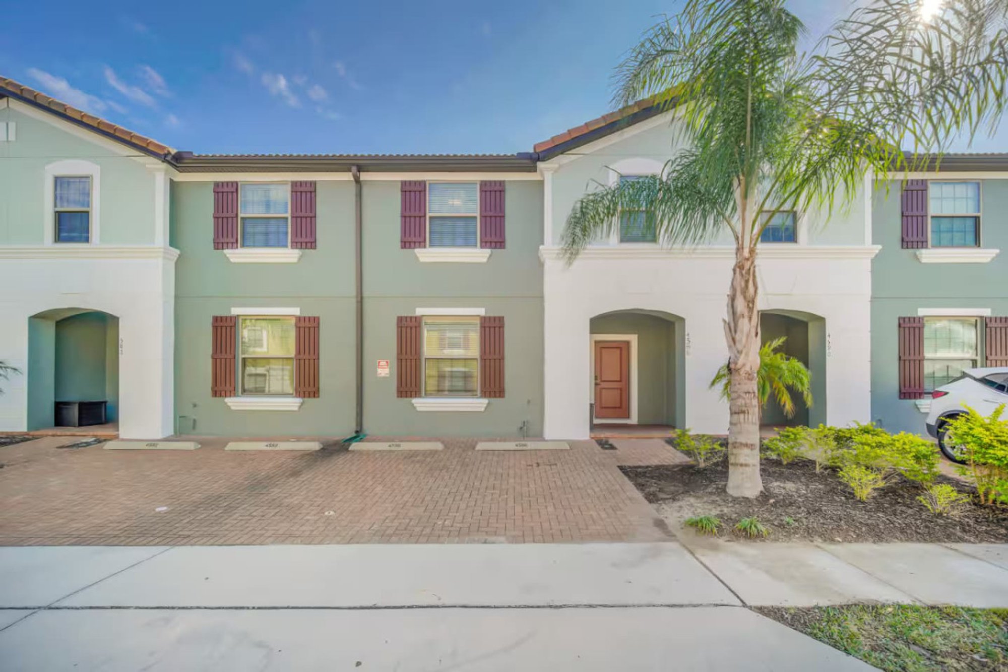Front of the townhouse with its driveway parking
