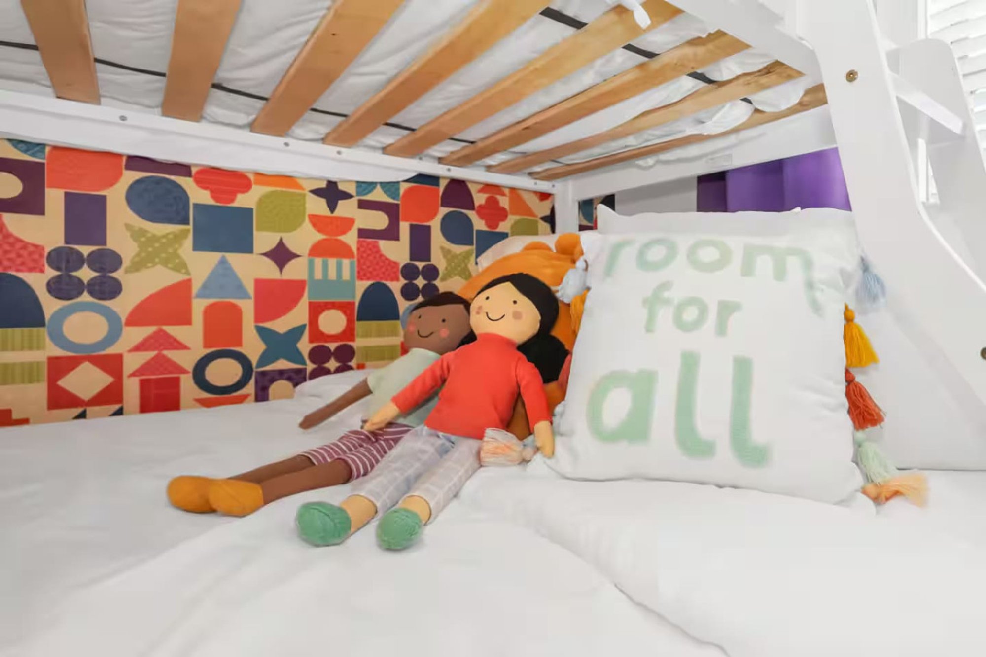 Room For All cushion and a doll on the lower bunk in Bedroom 3